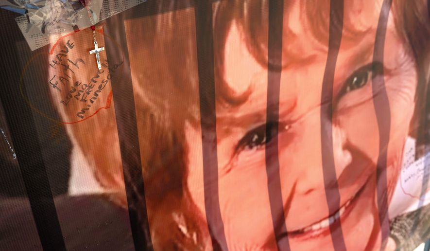 A banner with notes from hundreds of well-wishers for Nancy Guthrie, the missing mother of "Today" show host Savannah Guthrie, is displayed outside of KVOA Newsroom on March 6, 2026, in Tucson, Ariz. (AP Photo/Rebecca Noble, File)