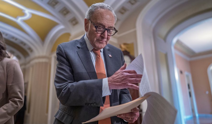 Senate Minority Leader Chuck Schumer, D-N.Y., looks over his notes as he speaks with reporters after a closed-door meeting with fellow Democrats, at the Capitol in Washington, Tuesday, Sept. 29, 2026. (AP Photo/J. Scott Applewhite)