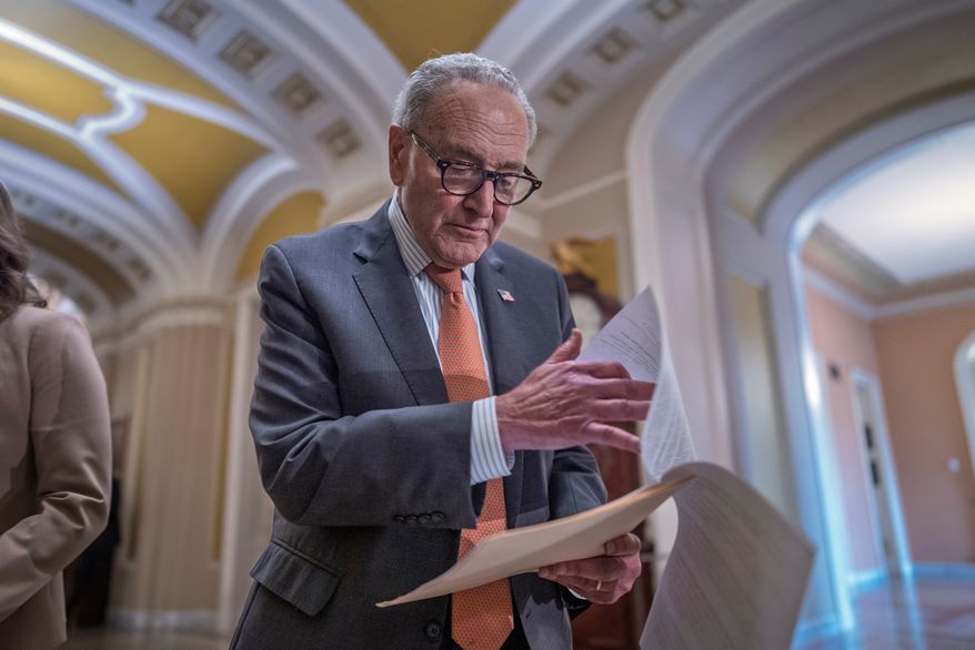 Senate Minority Leader Chuck Schumer, D-N.Y., looks over his notes as he speaks with reporters after a closed-door meeting with fellow Democrats, at the Capitol in Washington, Tuesday, Sept. 29, 2026. (AP Photo/J. Scott Applewhite)