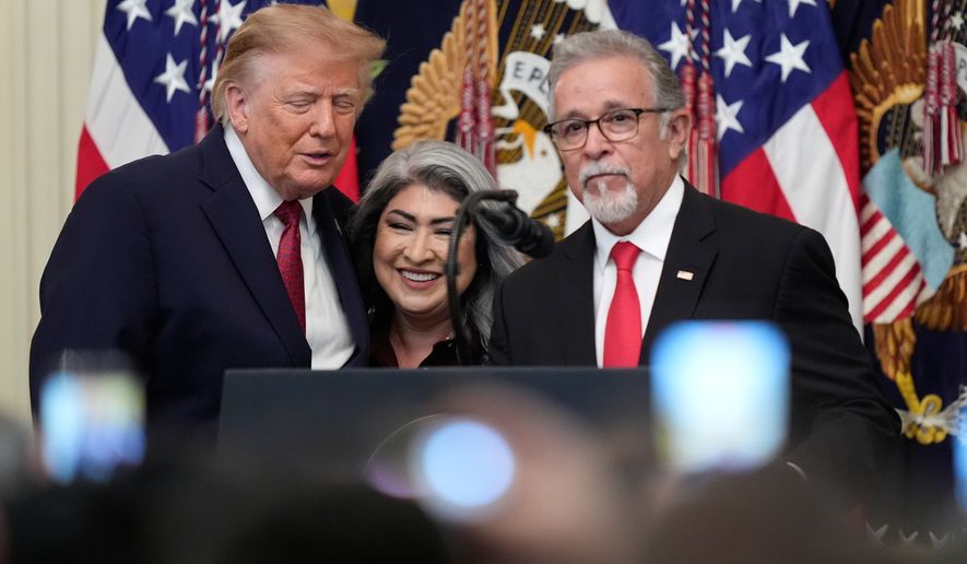 President Donald Trump stands with Pasqual and Norma Urrabazo during an East Room ceremony at the White House celebrating the Hispanic Heritage Month, Wednesday, Sept. 30, 2026 in Washington. (AP Photo/Manuel Balce Ceneta)