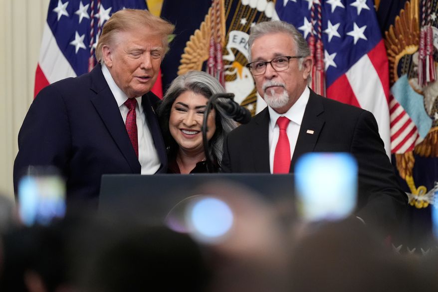 President Donald Trump stands with Pasqual and Norma Urrabazo during an East Room ceremony at the White House celebrating the Hispanic Heritage Month, Wednesday, Sept. 30, 2026 in Washington. (AP Photo/Manuel Balce Ceneta)