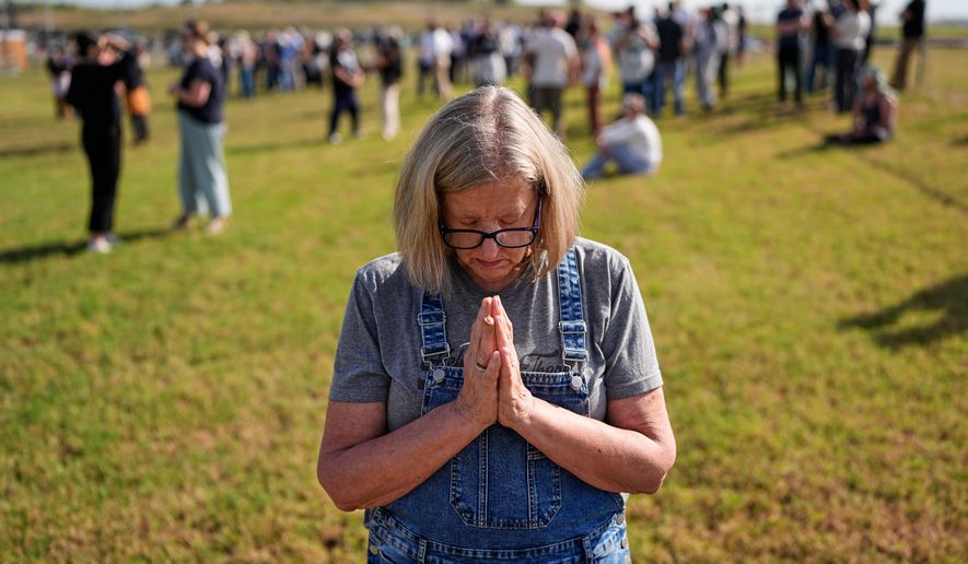 Kathleen Walter prays in the area reserved for people opposed to the death penalty outside Riverbend Maximum Security Institution before the planned execution of Christa Pike, Wednesday, Sept. 30, 2026, in Nashville, Tenn. (AP Photo/George Walker IV)