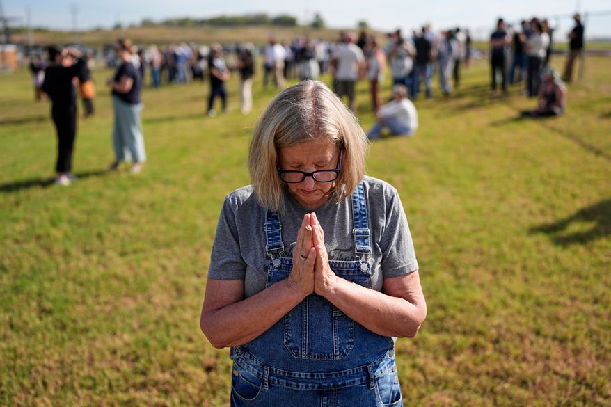 Kathleen Walter prays in the area reserved for people opposed to the death penalty outside Riverbend Maximum Security Institution before the planned execution of Christa Pike, Wednesday, Sept. 30, 2026, in Nashville, Tenn. (AP Photo/George Walker IV)