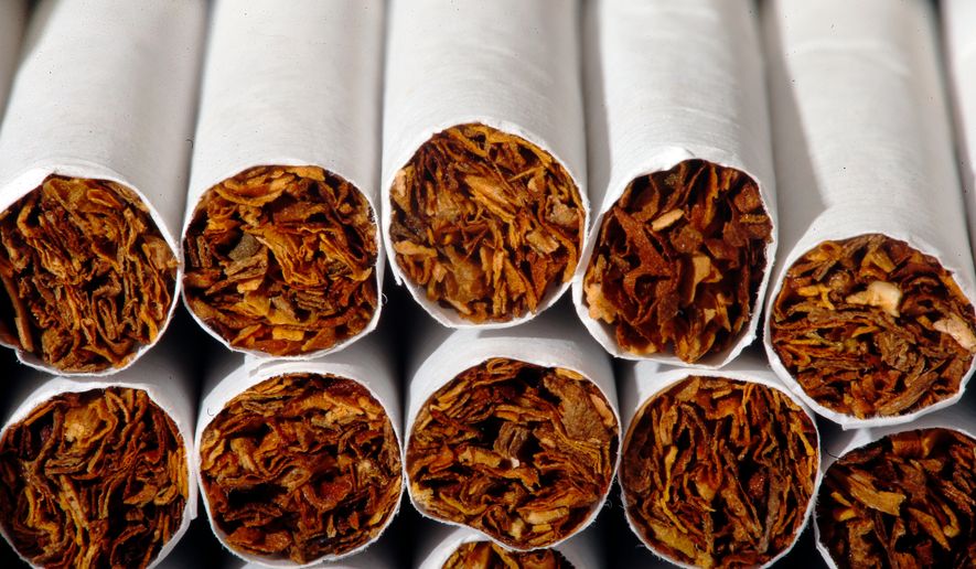 FILE - This Tuesday, July 15, 2014 photo shows the tobacco in cigarettes in Philadelphia. (AP Photo/Matt Rourke, File)