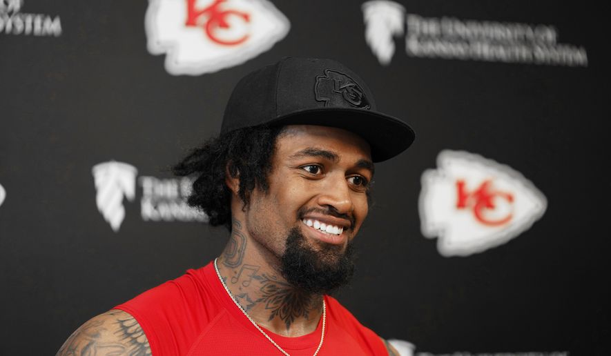Kansas City Chiefs tackle Josh Simmons talks with members of the media after an NFL football team's practice, June 9, 2026, in Kansas City, Mo. (AP Photo/Ed Zurga, File)