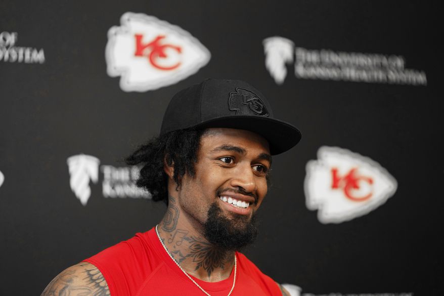 Kansas City Chiefs tackle Josh Simmons talks with members of the media after an NFL football team's practice, June 9, 2026, in Kansas City, Mo. (AP Photo/Ed Zurga, File)
