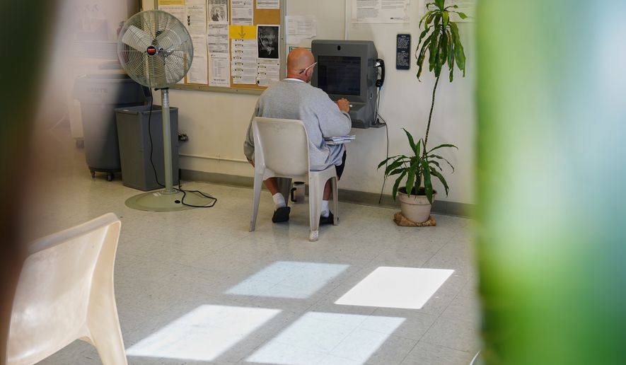 Fans are placed nearby while a person who is incarcerated has a virtual visit at a Minnesota Correctional Facility in Lino Lakes, Minn., Tuesday, Sept. 15, 2026. (AP Photo/Ellen Schmidt)