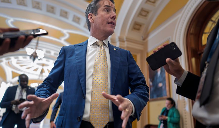 Sen. Bernie Moreno, R-Ohio, talks to reporters outside the chamber at the Capitol in Washington, Wednesday, Sept. 30, 2026. (AP Photo/J. Scott Applewhite)