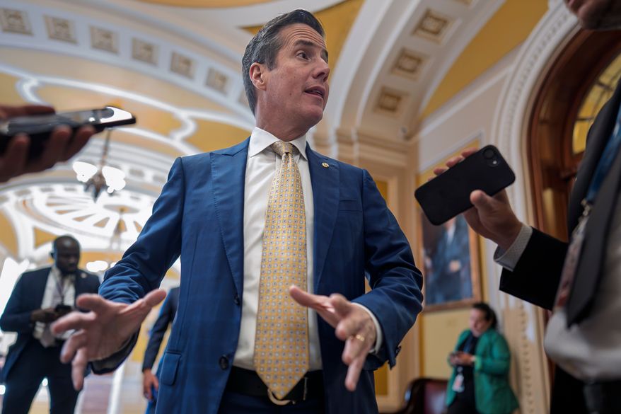 Sen. Bernie Moreno, R-Ohio, talks to reporters outside the chamber at the Capitol in Washington, Wednesday, Sept. 30, 2026. (AP Photo/J. Scott Applewhite)