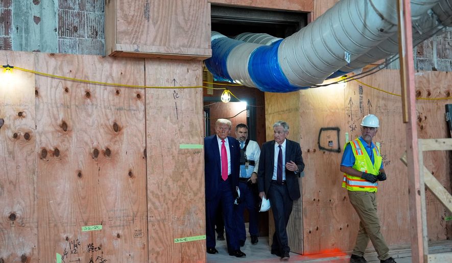 President Donald Trump, left, and Federal Reserve Chairman Jerome Powell, second right, visit the Federal Reserve in Washington on Thursday, July 24, 2025. (AP Photo/Julia Demaree Nikhinson) **FILE**