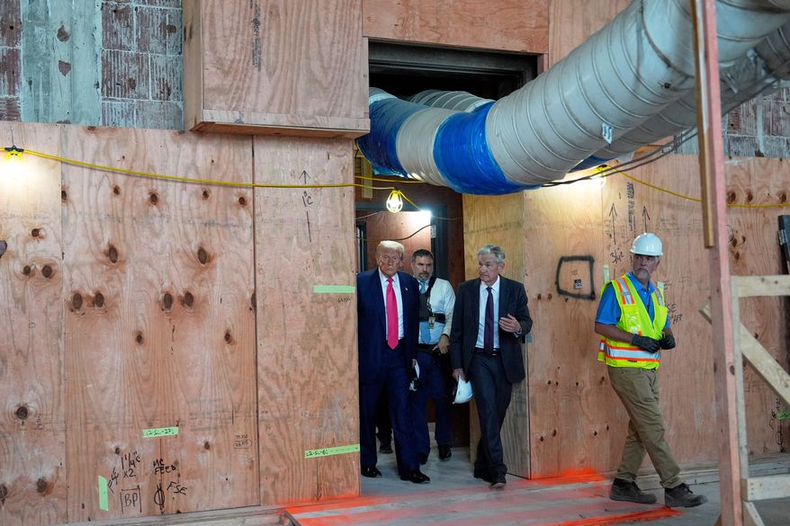 President Donald Trump, left, and Federal Reserve Chairman Jerome Powell, second right, visit the Federal Reserve in Washington on Thursday, July 24, 2025. (AP Photo/Julia Demaree Nikhinson) **FILE**
