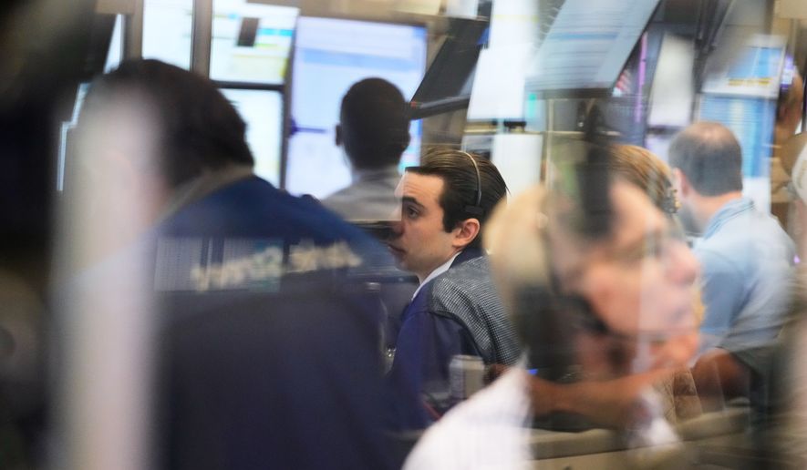 Traders work on the floor at the New York Stock Exchange in New York, Monday, Sept. 14, 2026. (AP Photo/Seth Wenig) ** FILE ***
