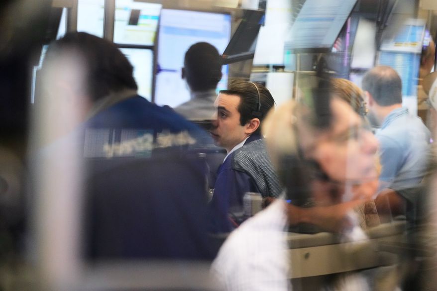Traders work on the floor at the New York Stock Exchange in New York, Monday, Sept. 14, 2026. (AP Photo/Seth Wenig) ** FILE ***