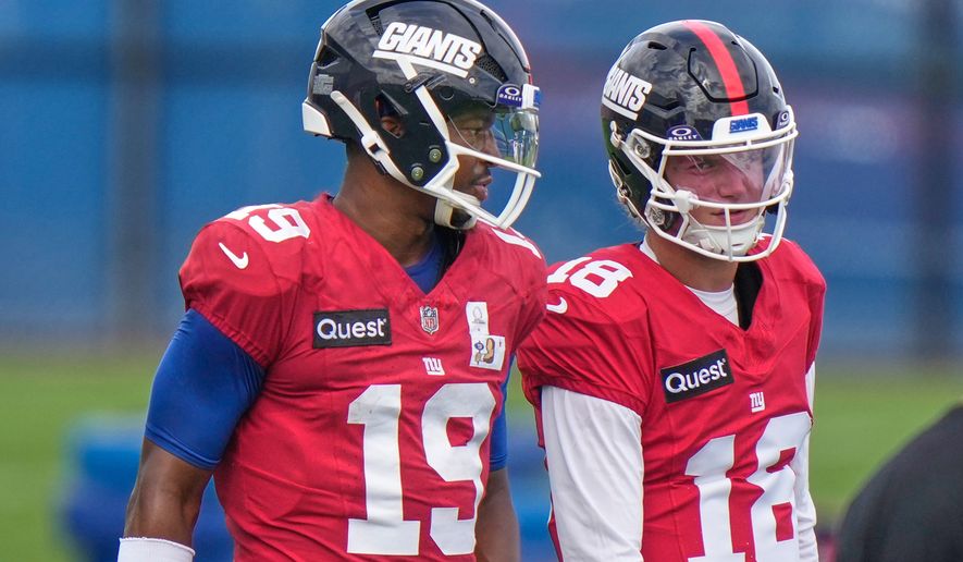 New York Giants' quarterbacks J.J. McCarthy, right, and Jameis Winston talk during a practice at the team's NFL football facilities in East Rutherford, N.J., Wednesday, Sept. 30, 2026. (AP Photo/Seth Wenig)