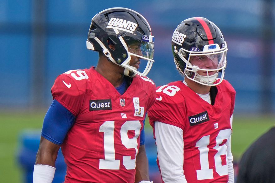 New York Giants' quarterbacks J.J. McCarthy, right, and Jameis Winston talk during a practice at the team's NFL football facilities in East Rutherford, N.J., Wednesday, Sept. 30, 2026. (AP Photo/Seth Wenig)