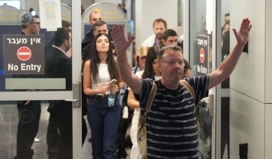 Israeli passenger Haim Lazarovich, who experienced an emergency landing in Saudi Arabia, during a flight on FlyDubai plane, arrives at Ben Gurion International Airport, near Tel Aviv, Israel, Wednesday, Sept. 30, 2026. (AP Photo/Ariel Schalit)