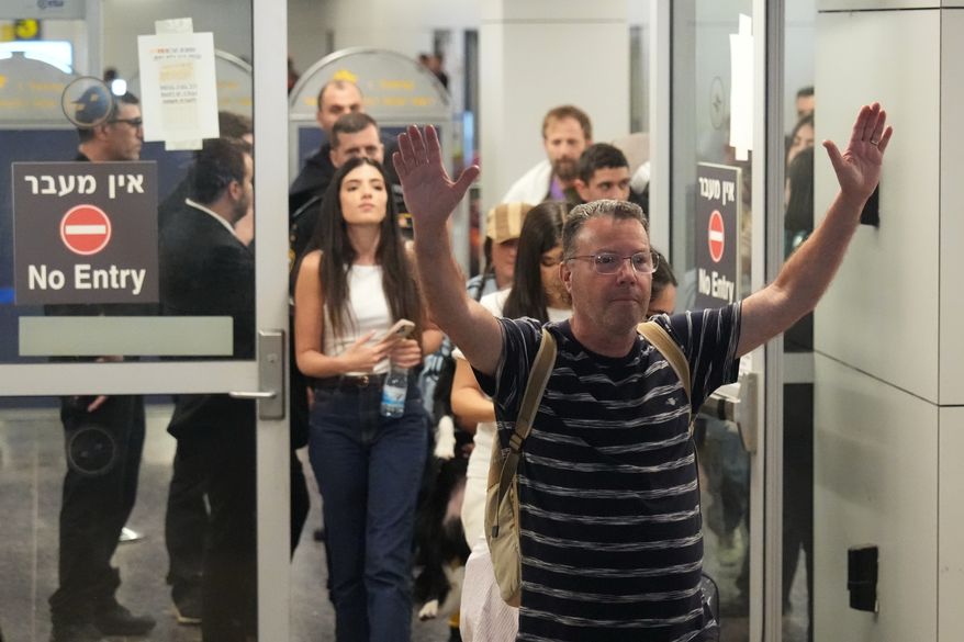 Israeli passenger Haim Lazarovich, who experienced an emergency landing in Saudi Arabia, during a flight on FlyDubai plane, arrives at Ben Gurion International Airport, near Tel Aviv, Israel, Wednesday, Sept. 30, 2026. (AP Photo/Ariel Schalit)
