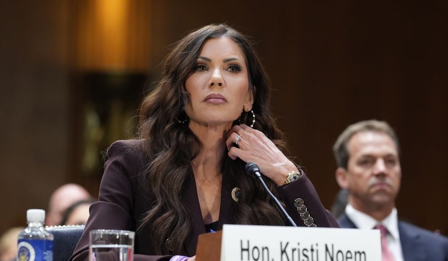 Homeland Security Secretary Kristi Noem, center, with her husband Bryon Noem, right, seated behind her, appears for an oversight hearing before the Senate Judiciary Committee, at the Capitol in Washington, March 3, 2026. (AP Photo/J. Scott Applewhite, File)