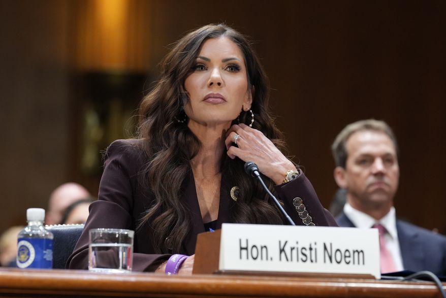 Homeland Security Secretary Kristi Noem, center, with her husband Bryon Noem, right, seated behind her, appears for an oversight hearing before the Senate Judiciary Committee, at the Capitol in Washington, March 3, 2026. (AP Photo/J. Scott Applewhite, File)