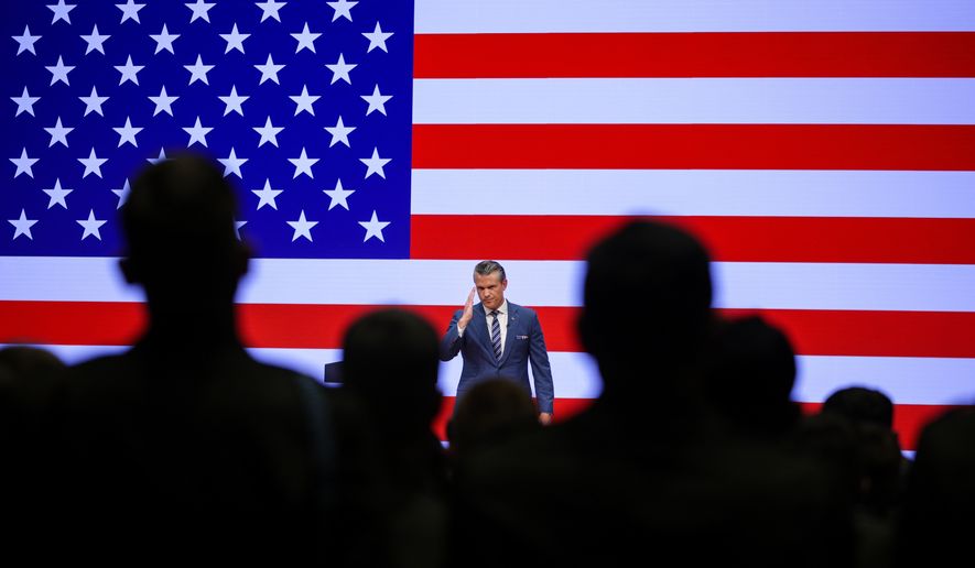 Secretary of Defense Pete Hegseth salutes troops after giving a State of the Force address at Marine Corps Base Quantico, Wednesday, Sept. 30, 2026 in Quantico, Va. (Alex Wong/Pool Photo via AP)