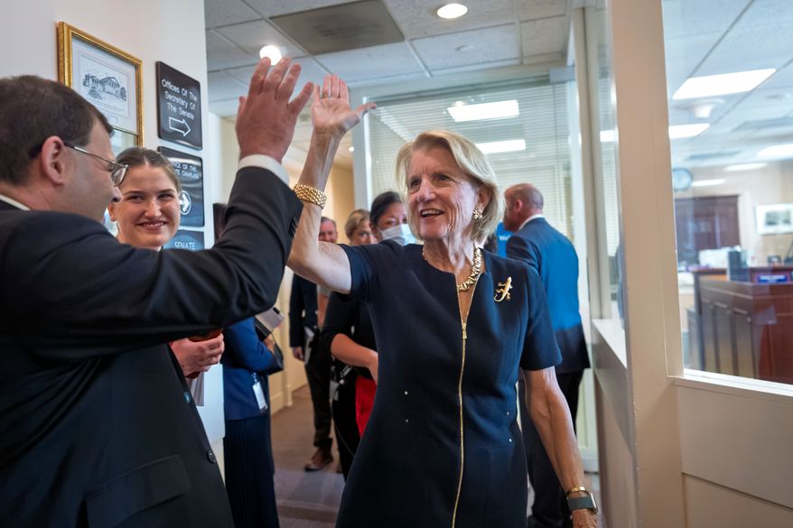 Sen. Shelly Moore Capito, R-W.Va., chair of the Environment and Public Works Committee, thanks members of her staff after announcing a bipartisan bill to reform the federal environmental review and permitting process, at the Capitol in Washington, Wednesday, Sept. 30, 2026. (AP Photo/J. Scott Applewhite)