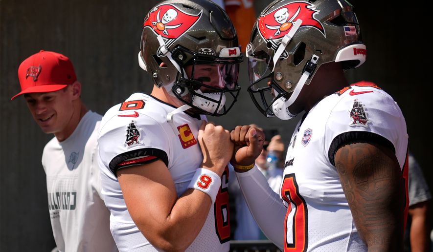 Tampa Bay Buccaneers quarterbacks Baker Mayfield (6) and Jalon Daniels (10) enter the field to warm up before an NFL football game against the Cincinnati Bengals Sunday, Sept. 13, 2026, in Cincinnati. (AP Photo/Carolyn Kaster)