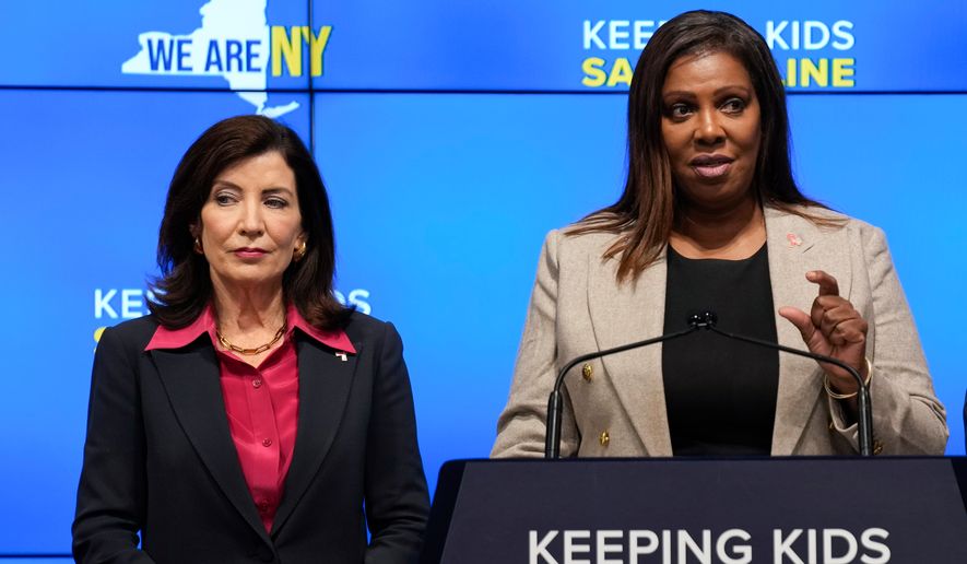 New York Gov. Kathy Hochul, left, listens as Attorney General Letitia James speaks during a news conference in New York, Oct. 11, 2023. (AP Photo/Seth Wenig, File)