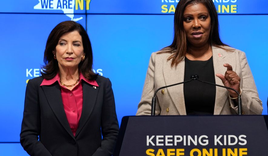 FILE - New York Gov. Kathy Hochul, left, listens as Attorney General Letitia James speaks during a news conference in New York, Oct. 11, 2023. (AP Photo/Seth Wenig, File)
