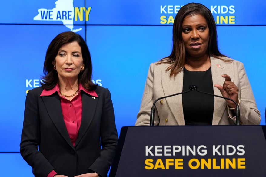FILE - New York Gov. Kathy Hochul, left, listens as Attorney General Letitia James speaks during a news conference in New York, Oct. 11, 2023. (AP Photo/Seth Wenig, File)