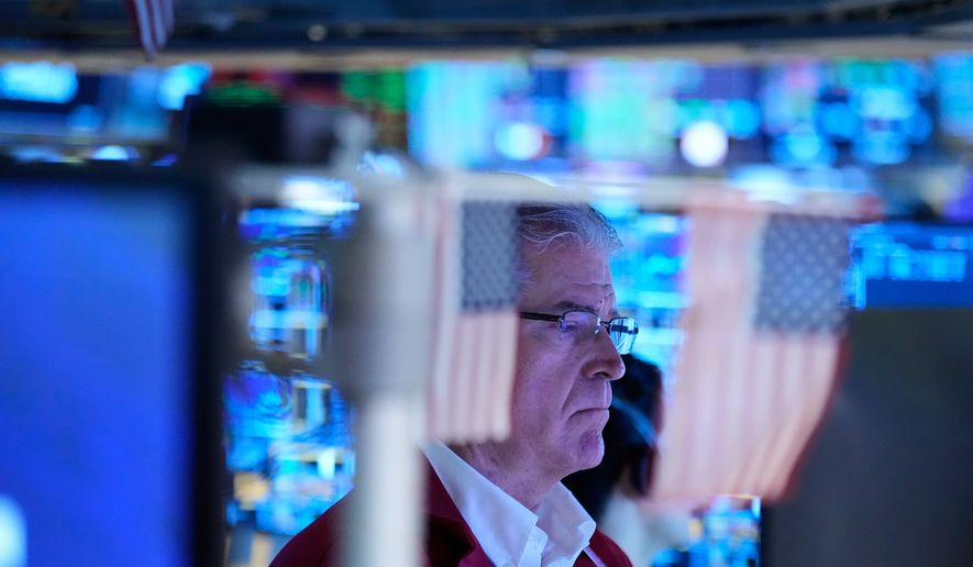 Daniel Kryger works on the floor at the New York Stock Exchange in New York, Monday, Sept. 14, 2026. (AP Photo/Seth Wenig)
