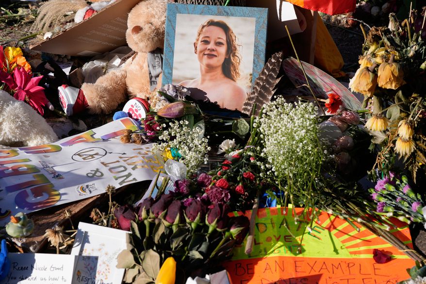 FILE - Flowers and photos are left at a memorial site for Renee Good on Saturday, Jan. 31, 2026, in Minneapolis. (AP Photo/Alex Brandon, File)