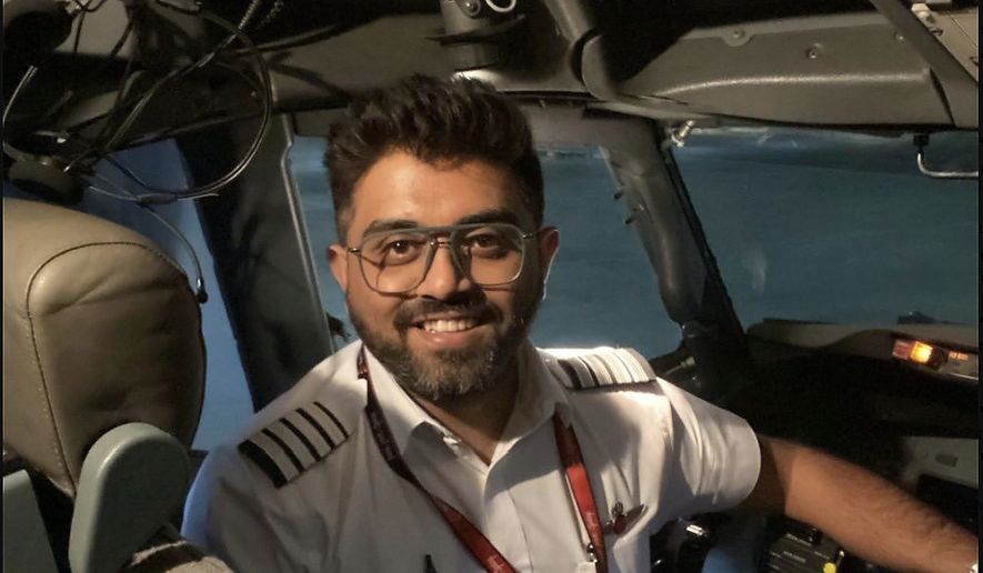 This undated photo released on Israel's Foreign Ministry social media shows Indian Capt. Smit Machchhar in the cockpit of a plane in an unknown location. Machchhar was at the controls of a FlyDubai flight that was diverted to Tabuk in northwestern Saudi Arabia for an emergency landing on Wednesday, Sept. 30, 2026. (Israel's Foreign Ministry via AP)