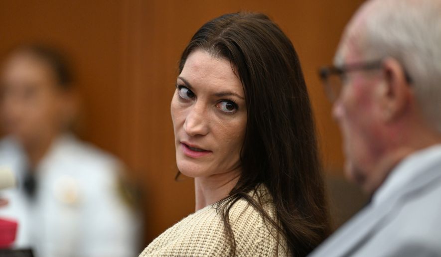 Lindsay Clancy, center, speaks with her lawyer Kevin Reddington during proceedings in her murder trial, Aug. 20, 2026, in Plymouth, Mass. (AP Photo/Josh Reynolds, Pool, File)