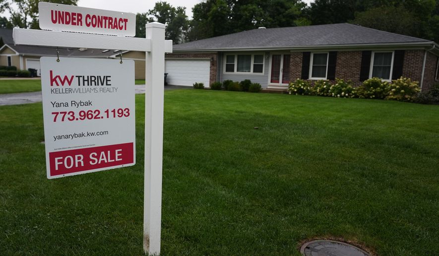 For sale sign is seen outside of a home in Arlington Heights, Ill., Wednesday, Sept. 16, 2026. (AP Photo/Nam Y. Huh)
