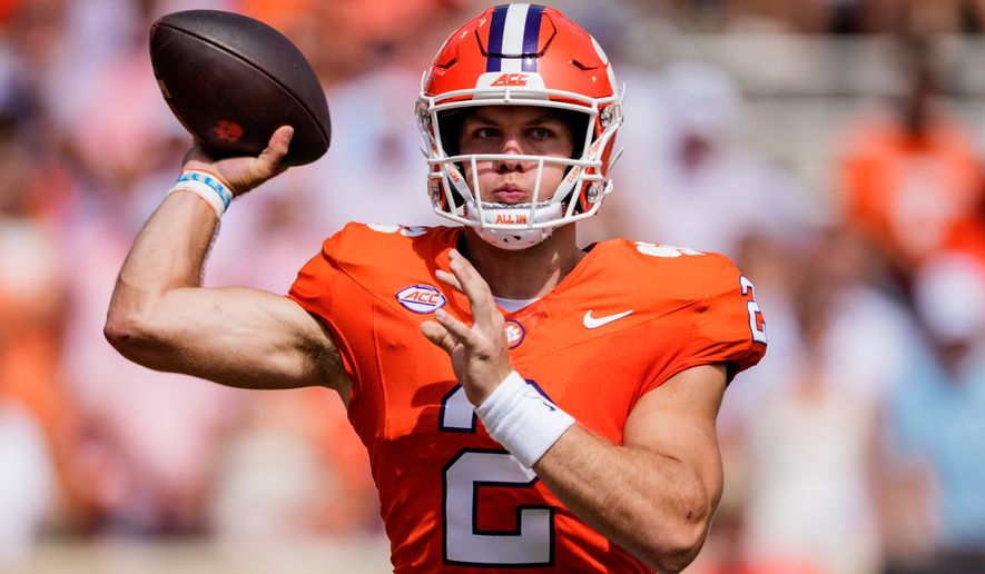 Clemson quarterback Tait Reynolds passes the ball in the first half of an NCAA college football game against North Carolina Saturday, Sept. 19, 2026, in Clemson, S.C. (AP Photo/Jacob Kupferman)