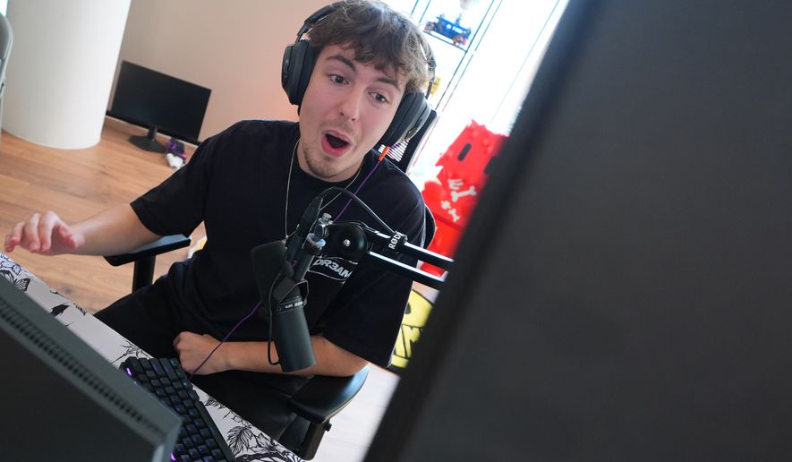 Competitive gamer and Twitch streamer Cody "Clix" Conrod conducts a live stream from his apartment in downtown Dallas, Tuesday, Sept. 29, 2026. (AP Photo/LM Otero)