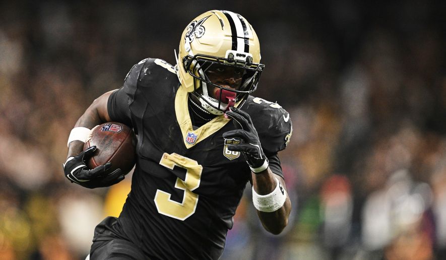 New Orleans Saints running back Travis Etienne Jr. (3) carries the ball during the second half of an NFL football game against the Las Vegas Raiders in New Orleans, Sunday, Sept. 27, 2026. (AP Photo/Ella Hall)
