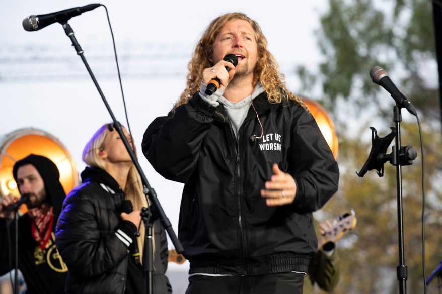 Christian musician Sean Feucht, of California, preaches to the crowd during a rally at the National Mall in Washington, Oct. 25, 2020. (AP Photo/Jose Luis Magana, File)