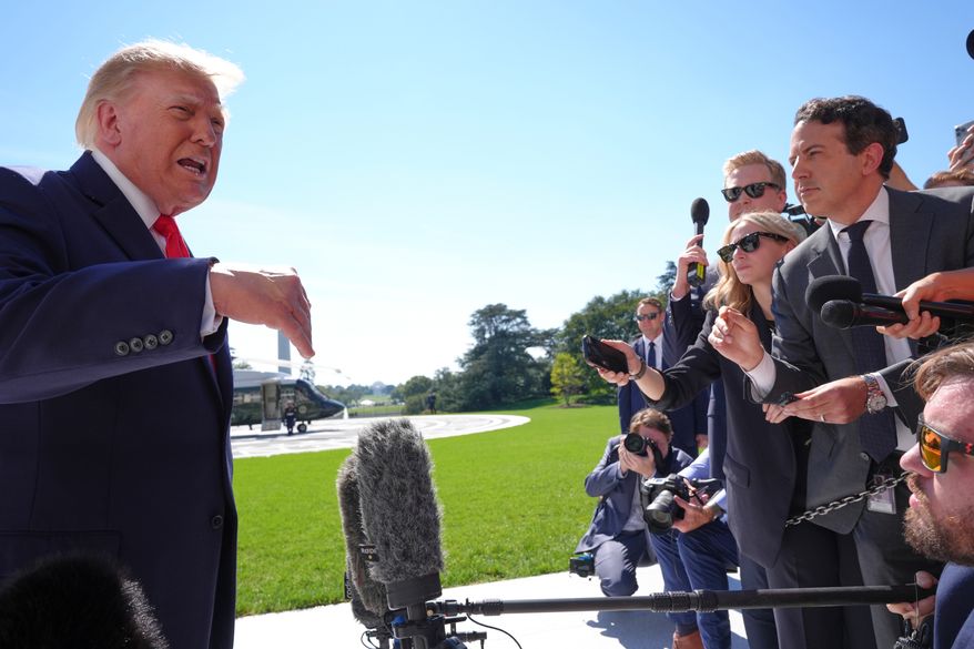 President Donald Trump speaks with reporters before boarding Marine One on the South Lawn of the White House, Thursday Oct. 1, 2026, in Washington. (AP Photo/Jacquelyn Martin)