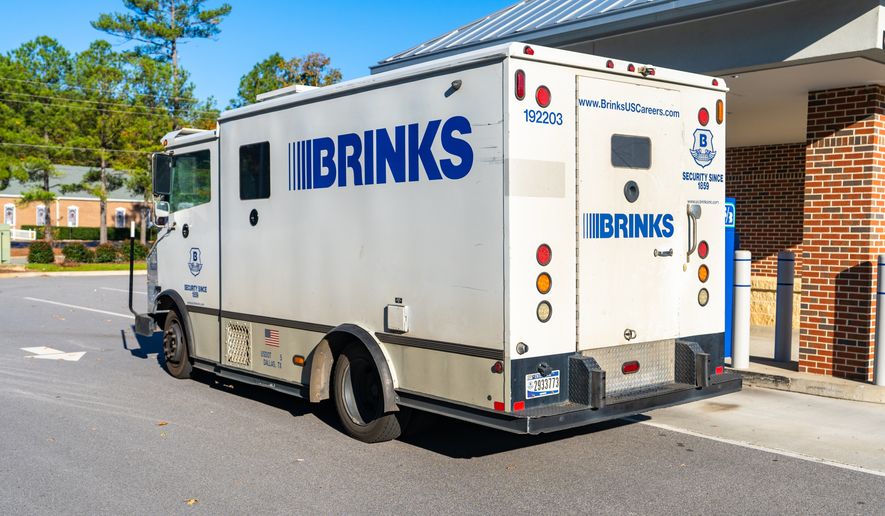 A Brink's armored security truck parked outside a bank for cash transport service. File photo credit: PJ McDonnell via Shutterstock.