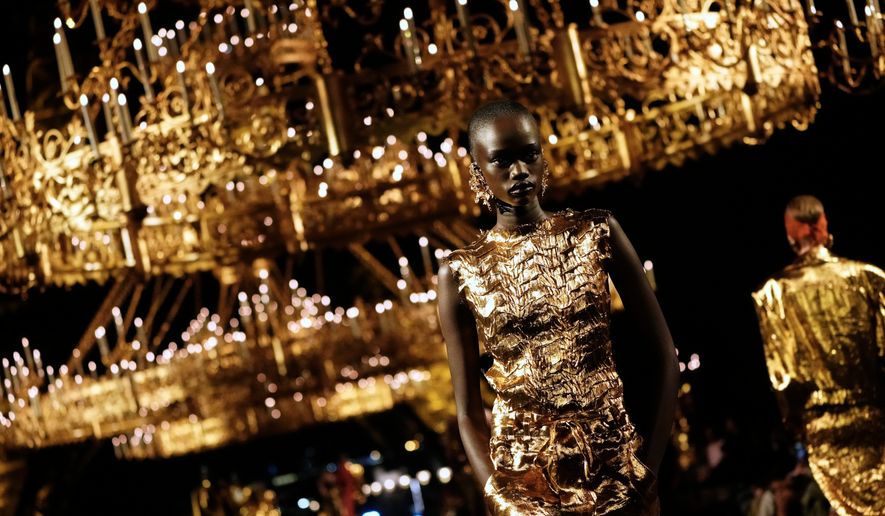 A model wears a creation as part of the Saint Laurent Womenswear Spring Summer 2027 collection presented in Paris, France, Tuesday, Sept. 29, 2026. (AP Photo/Teresa Suarez)