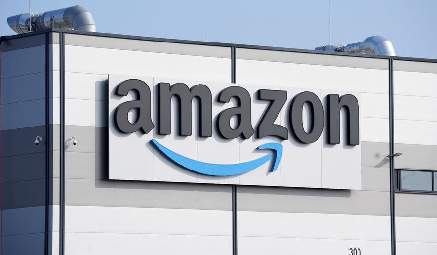 An Amazon company logo marks the facade of a building, March 18, 2022, in Schoenefeld near Berlin. (AP Photo/Michael Sohn, File)