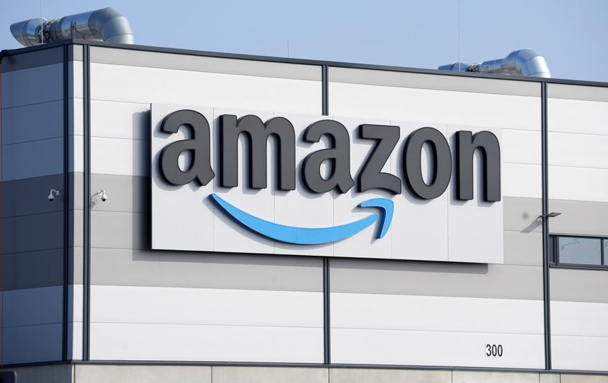 An Amazon company logo marks the facade of a building, March 18, 2022, in Schoenefeld near Berlin. (AP Photo/Michael Sohn, File)