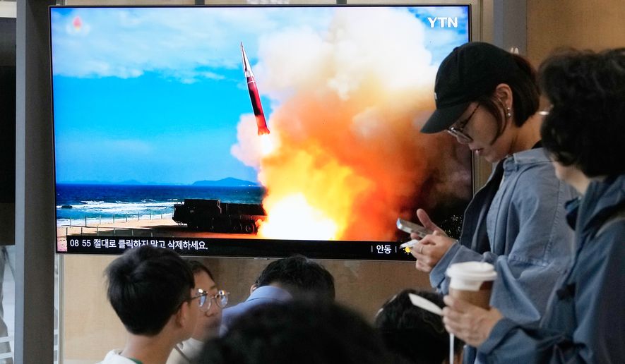 A TV screen shows a file image of a North Korean missile launch during a news program at Seoul Railway Station in Seoul, South Korea, Saturday, Oct. 3, 2026. (AP Photo/Ahn Young-joon)