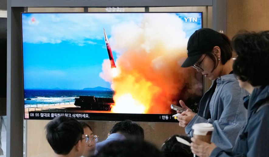 A TV screen shows a file image of a North Korean missile launch during a news program at Seoul Railway Station in Seoul, South Korea, Saturday, Oct. 3, 2026. (AP Photo/Ahn Young-joon)