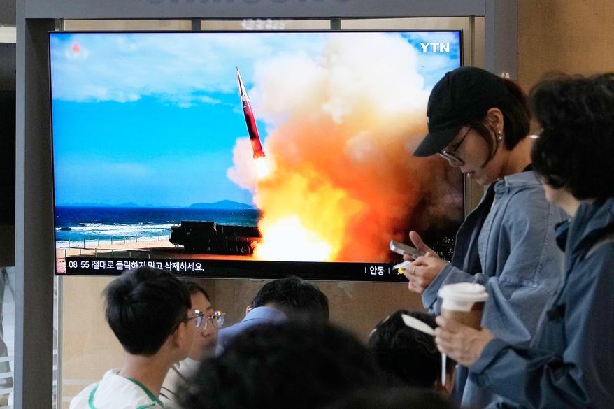A TV screen shows a file image of a North Korean missile launch during a news program at Seoul Railway Station in Seoul, South Korea, Saturday, Oct. 3, 2026. (AP Photo/Ahn Young-joon)