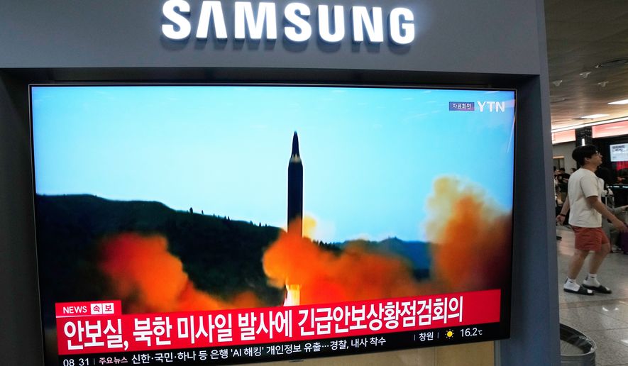 A TV screen shows a file image of a North Korean missile launch during a news program at Seoul Railway Station in Seoul, South Korea, Saturday, Oct. 3, 2026. (AP Photo/Ahn Young-joon)