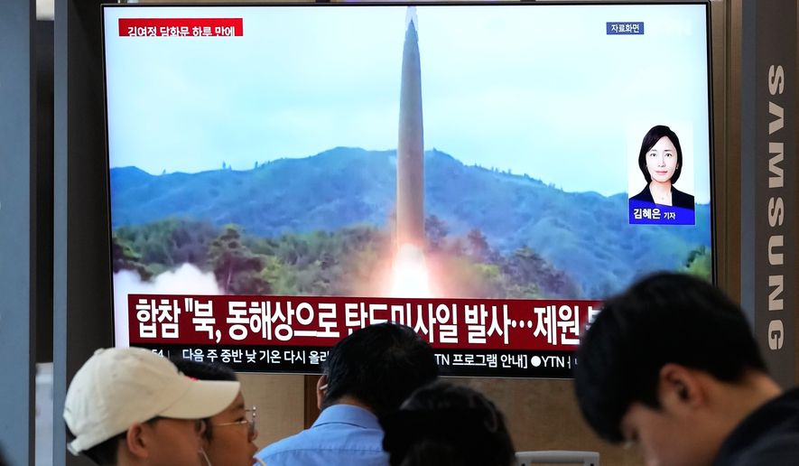 A TV screen shows a file image of a North Korean missile launch during a news program at Seoul Railway Station in Seoul, South Korea, Saturday, Oct. 3, 2026. (AP Photo/Ahn Young-joon)
