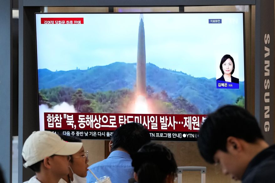 A TV screen shows a file image of a North Korean missile launch during a news program at Seoul Railway Station in Seoul, South Korea, Saturday, Oct. 3, 2026. (AP Photo/Ahn Young-joon)
