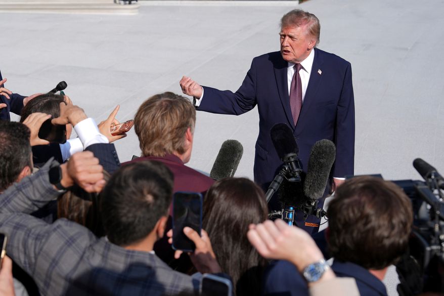 President Donald Trump speaks to reporters on the South Lawn of the White House before boarding Marine One, Friday, Oct. 2, 2026, in Washington. (AP Photo/Mark Schiefelbein)